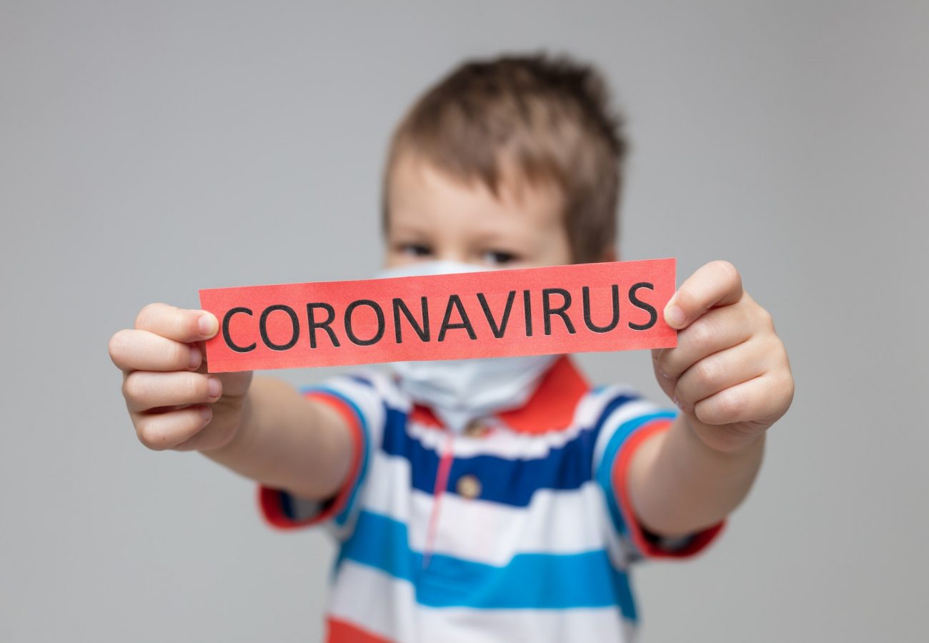 Young child wearing a respiratory mask as a prevention against the Coronavirus Covid-19